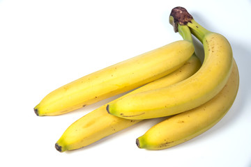 bananas against white background. four things