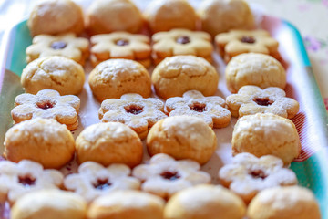 shortbread and coconut biscuits on a wood background