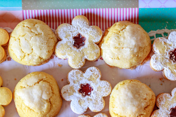 shortbread and coconut biscuits on a wood background
