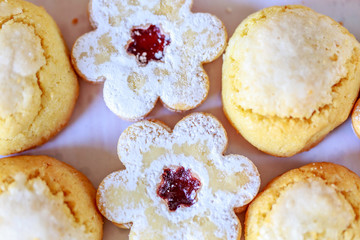 shortbread and coconut biscuits on a wood background