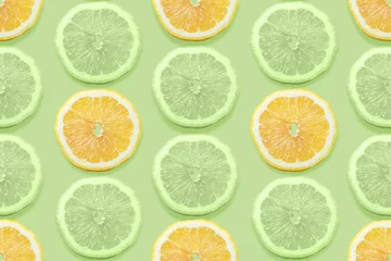 Papier Peint photo Citrons Modèle sans couture de fruits avec tranche de citrons sur fond abstrait pastel vert.