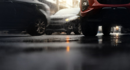 Hard rain fall in the city with blurry cars .Selective focus.