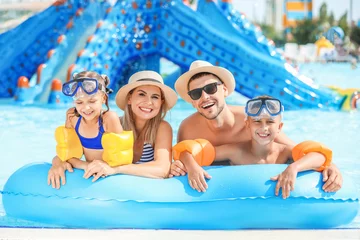 Peel and stick wall murals Amusement parc Happy family resting in aqua park