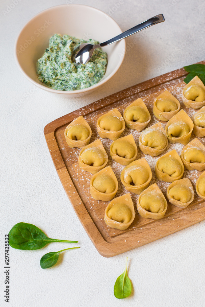 Poster Tortelloni - italian pasta stuffed with ricotta and spinach. Raw, homemade.