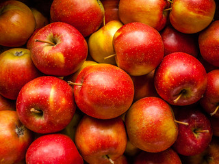 Fresh delicious red apples on the store counter