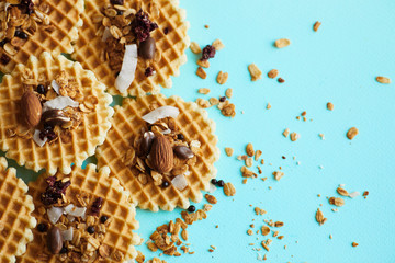 Traditional belgian waffles with nuts mix, oatmeal and almonds. Haealthy food. Flat lay, top view, copy space