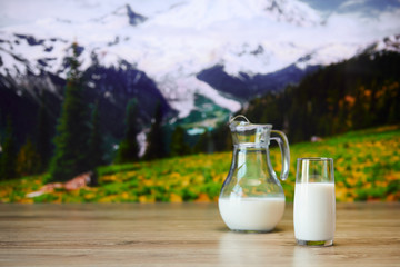 Close up view of glass of milk on the background of nature.