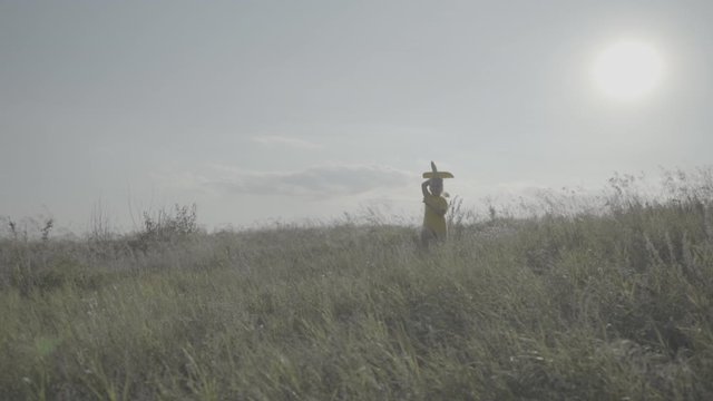 A girl runs with an airplane in her hands. Funny girl in a yellow T-shirt with a yellow airplane. No color grading. Child Game. The girl dreams of becoming a pilot. Dreams. Memories. Home video