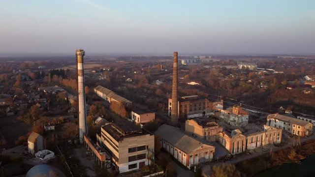 Aerial view of an old factory ruin and broken windows. Old industrial building.