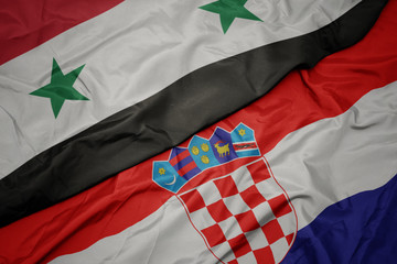 waving colorful flag of croatia and national flag of syria.