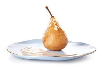Fototapeta premium Plate with tasty cooked pear on white background