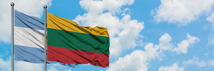 Argentina and Lithuania flag waving in the wind against white cloudy blue sky together. Diplomacy concept, international relations.