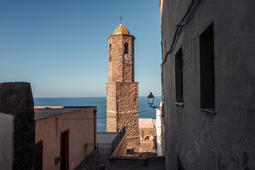 Fototapeta na wymiar CASTELSARDO, SARDINIA / OCTOBER 2019: view of the bell tower of the cathedral
