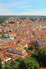 Fototapeta na wymiar View from the bell tower of the Church of St. Euphemia on the tiled rooftops of the romantic and colorful town of Rovinj, Croatia, located in the north of the Adriatic Sea. Europe.