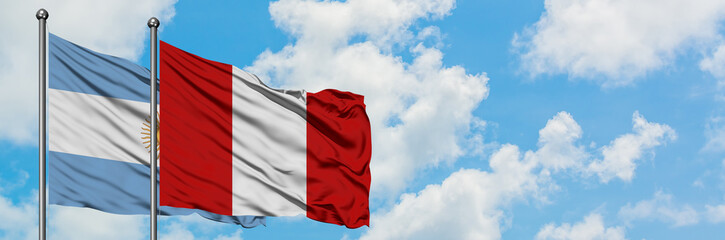 Argentina and Peru flag waving in the wind against white cloudy blue sky together. Diplomacy concept, international relations.
