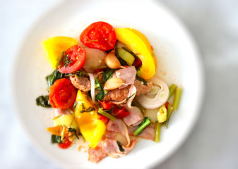 Asian cuisine, fresh green vegetables with meat, peas, peppers, zucchini, ingredients, for a hot menu