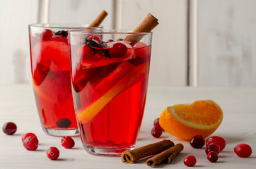 Orange and cranberry punch with orange slices and spices. Top view.