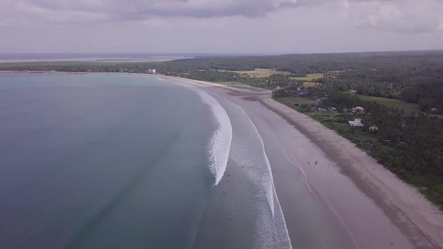 Aerial view of the beach of Sorsogon in Philippines with long waves and white sand.
