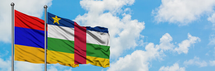 Fototapeta na wymiar Armenia and Central African Republic flag waving in the wind against white cloudy blue sky together. Diplomacy concept, international relations.