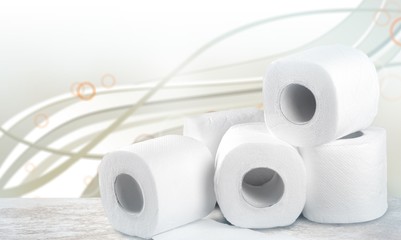 rolls of white toilet paper on table