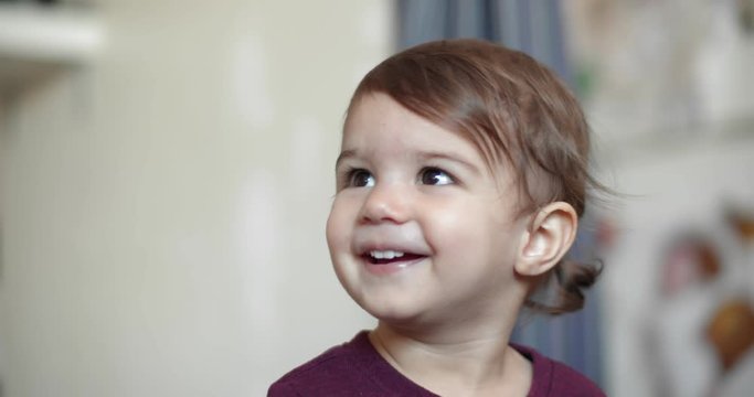 Toddler Girl Enthralled By Song Playing On TV. Cinematic 4K Footage.