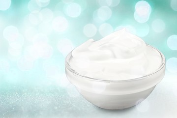 close up of a white beauty cream or yogurt on white background with clipping path
