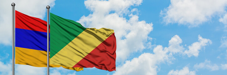 Armenia and Republic Of The Congo flag waving in the wind against white cloudy blue sky together. Diplomacy concept, international relations.