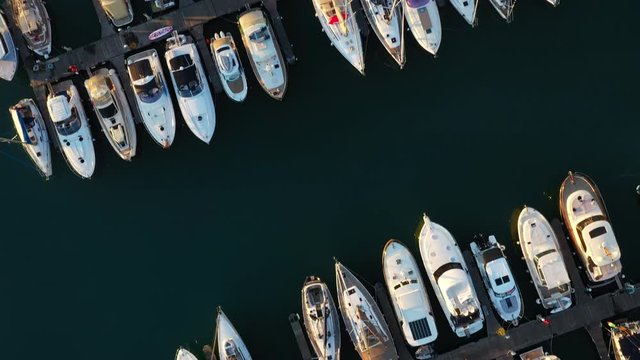 Top View Aerial Drone Footage: Flight Over Marina Bay with Yachts of Different Sizes