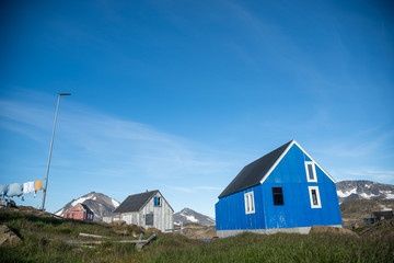 Fototapeta na wymiar Colourful houses in the small fishing town of Kulusuk, Greenland. 