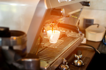 Barista make coffee latte art with espresso machine in cafe vintage color tone.Vintage Coffee Making 