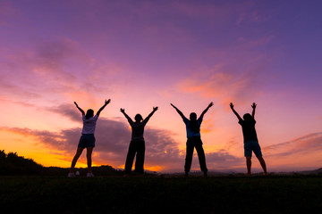 Group of healthy girl show hands with  sunset background.Healthy exercise lifestyle concept.