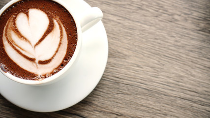   Coffee late art .It toping chocolate  on milk mug