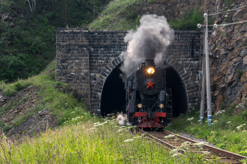 The locomotive leaves the tunnel