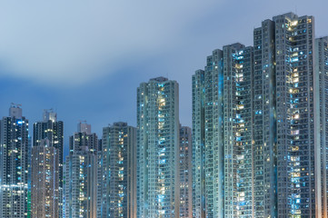 High rise residential buiilding in Hong Kong city at night