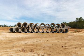 Concrete drainage pipes on contruction site of new home development.