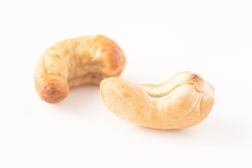 Fototapeta premium Cashew nuts isolated against white