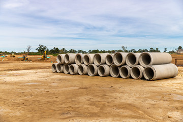 Concrete drainage pipes on contruction site of new home development.