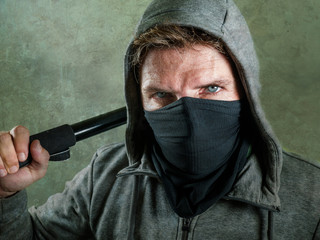 young man as fanatic and aggressive ultra anarchist rioter . furious anti-system protester in face...