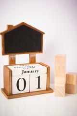 Happy New Year concept. 2020 wordings with wooden block calender showing 1st January isolated against white