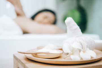 Beautiful young woman lying down on beds massage and spa at asian spa massage and beauty salon center, spa concept, massage concept