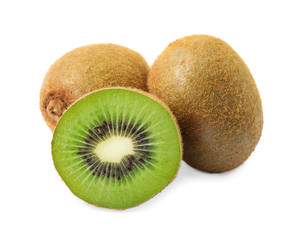Cut and whole fresh kiwis on white background
