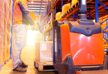 Warehouse worker working in storage warehouse, warehouse inventory management