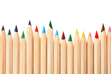 Different color pencils on white background, top view. School stationery