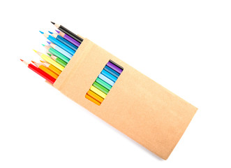 Box of color pencils on white background, top view