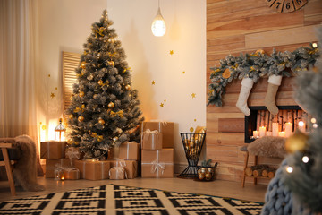 Stylish room interior with beautiful Christmas tree and decorative fireplace