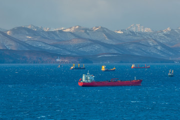 Marine landscape with views of the Avacha Bay with the ships.