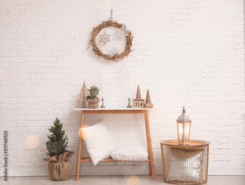 Console Table With Christmas Decoration Near Brick Wall Idea For