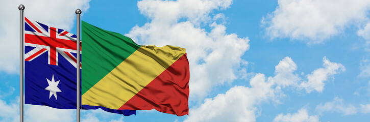 Fototapeta na wymiar Australia and Republic Of The Congo flag waving in the wind against white cloudy blue sky together. Diplomacy concept, international relations.