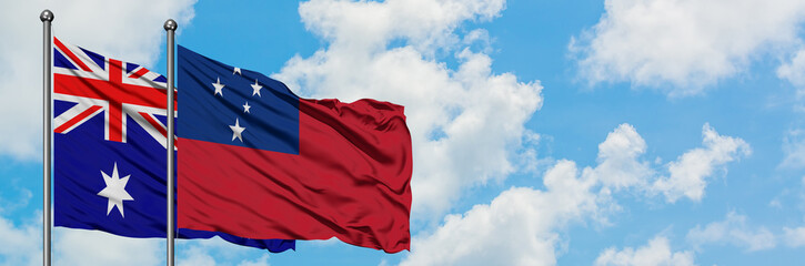 Naklejka premium Australia and Samoa flag waving in the wind against white cloudy blue sky together. Diplomacy concept, international relations.