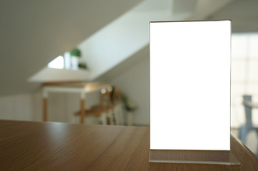 Menu frame standing on wood table in Bar restaurant cafe. space for text marketing promotion.